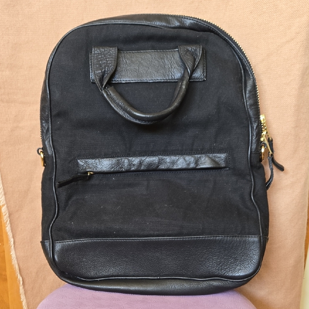 Gold and Black Backpack with Structured Design and Durable Fabric